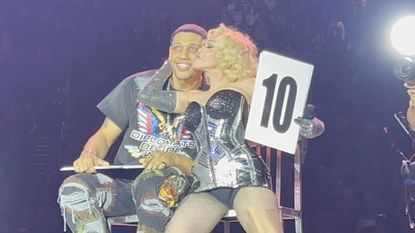 Madonna brings boyfriend Josh Popper onstage during New York City concert.