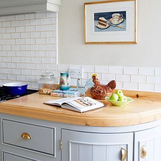 kitchen with wooden worktop and cookie jars