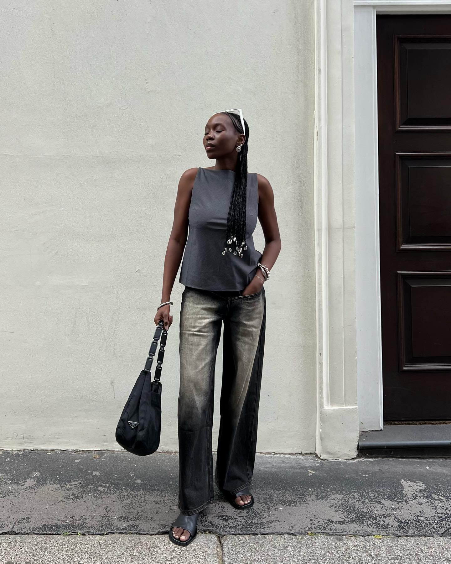 Woman wearing a boatneck top.