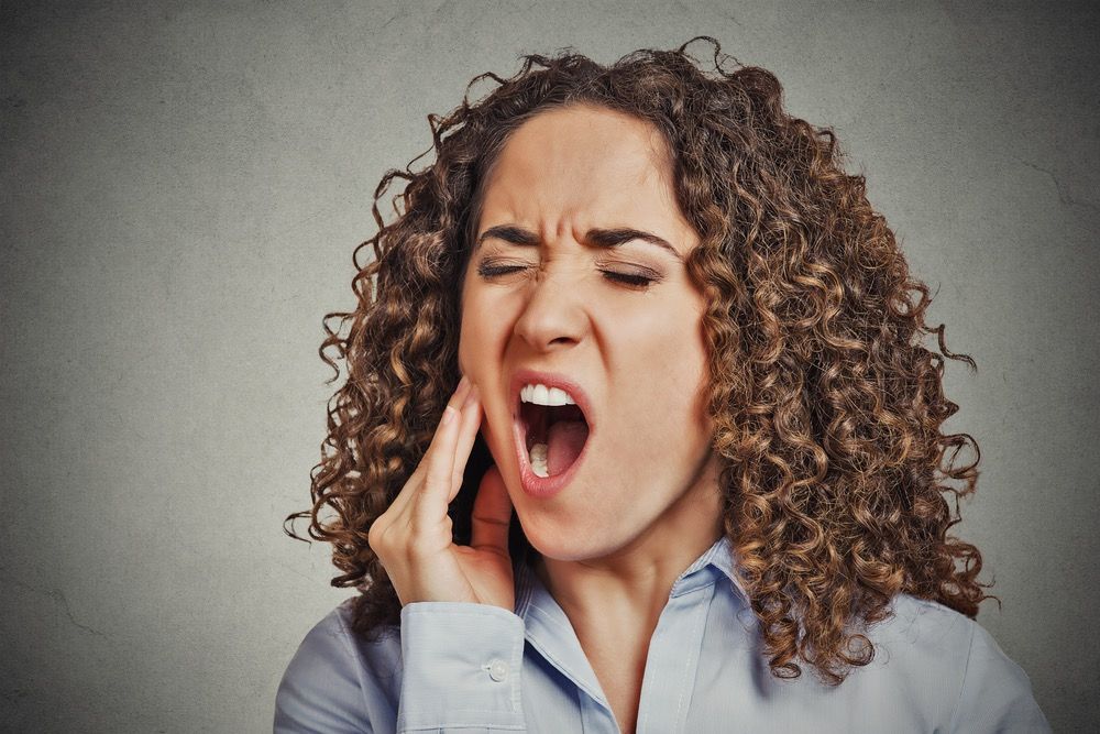 portrait of a woman with toothache