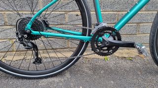 Close up of a drivetrain on a green bike