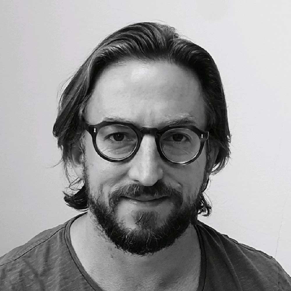 black and white headshot of CEO of Garolla Alistair Mayne