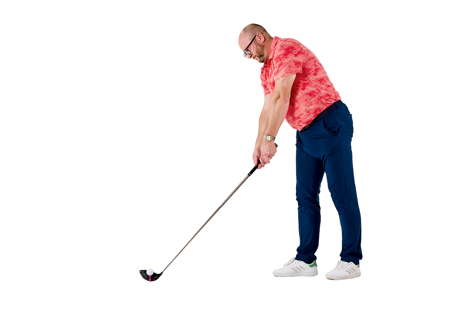 Russell Covey stepping in with his trail foot as he enters the setup position with driver, focusing on alignment with a secondary target