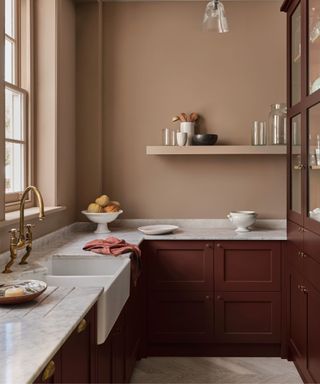 Brown wooden cabinets, light brown walls and shelf