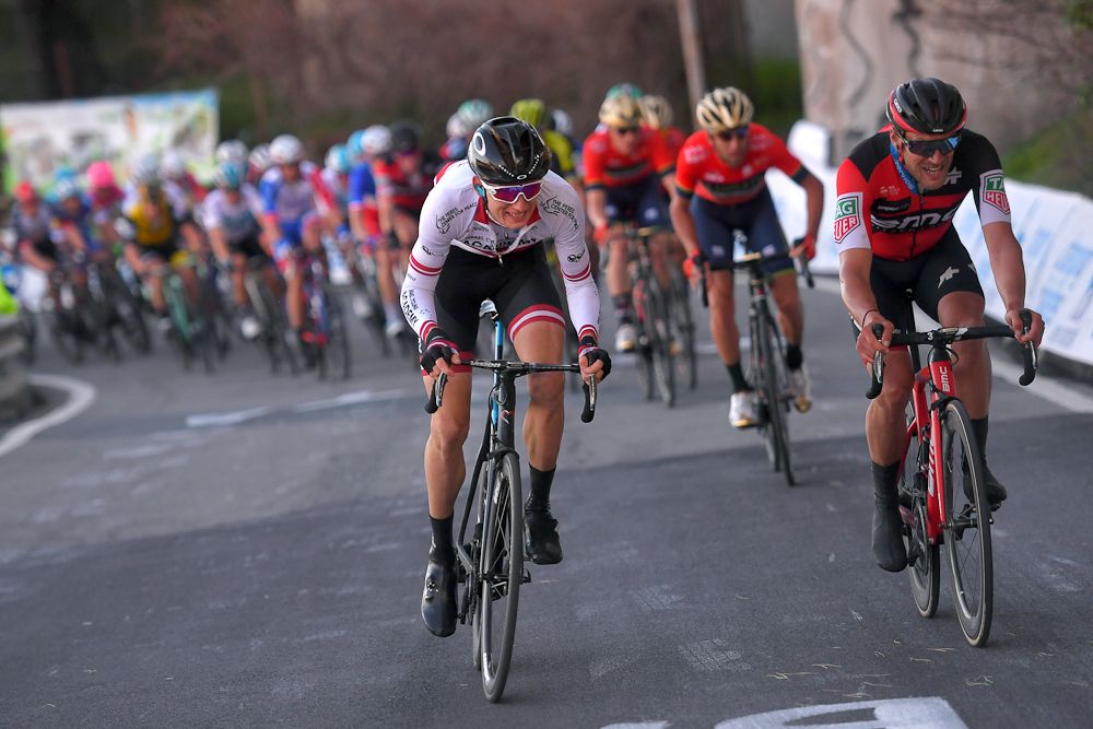 Krists Neilands (Israel Cycling Academy) attacks on the Poggio next to Greg Van Avermaet (BMC) as Vincenzo Nibali (Bahrain-Merida) gets ready to counter