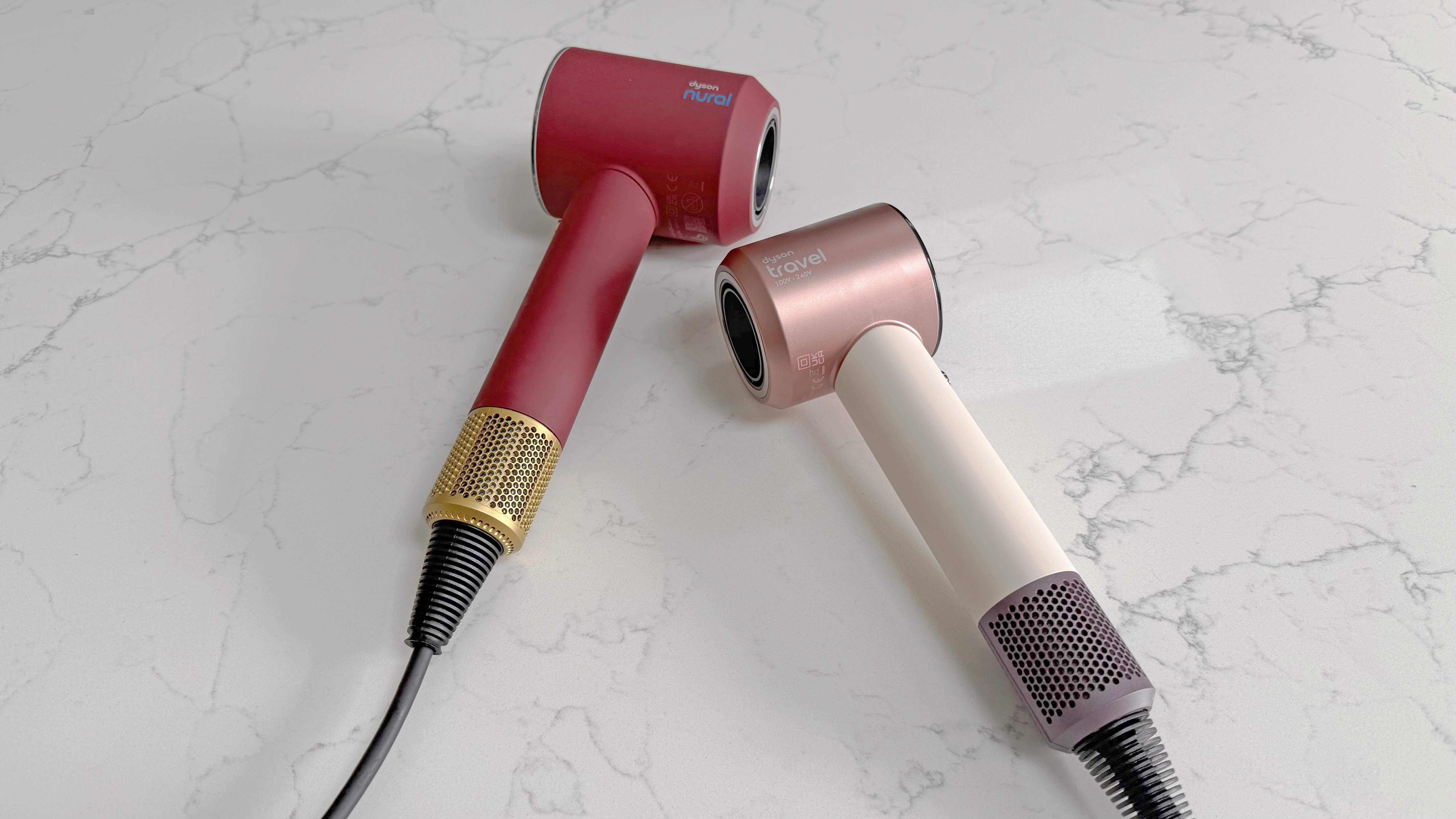 Dyson Supersonic Nural and Dyson Supersonic Travel hair dryers placed side by side
