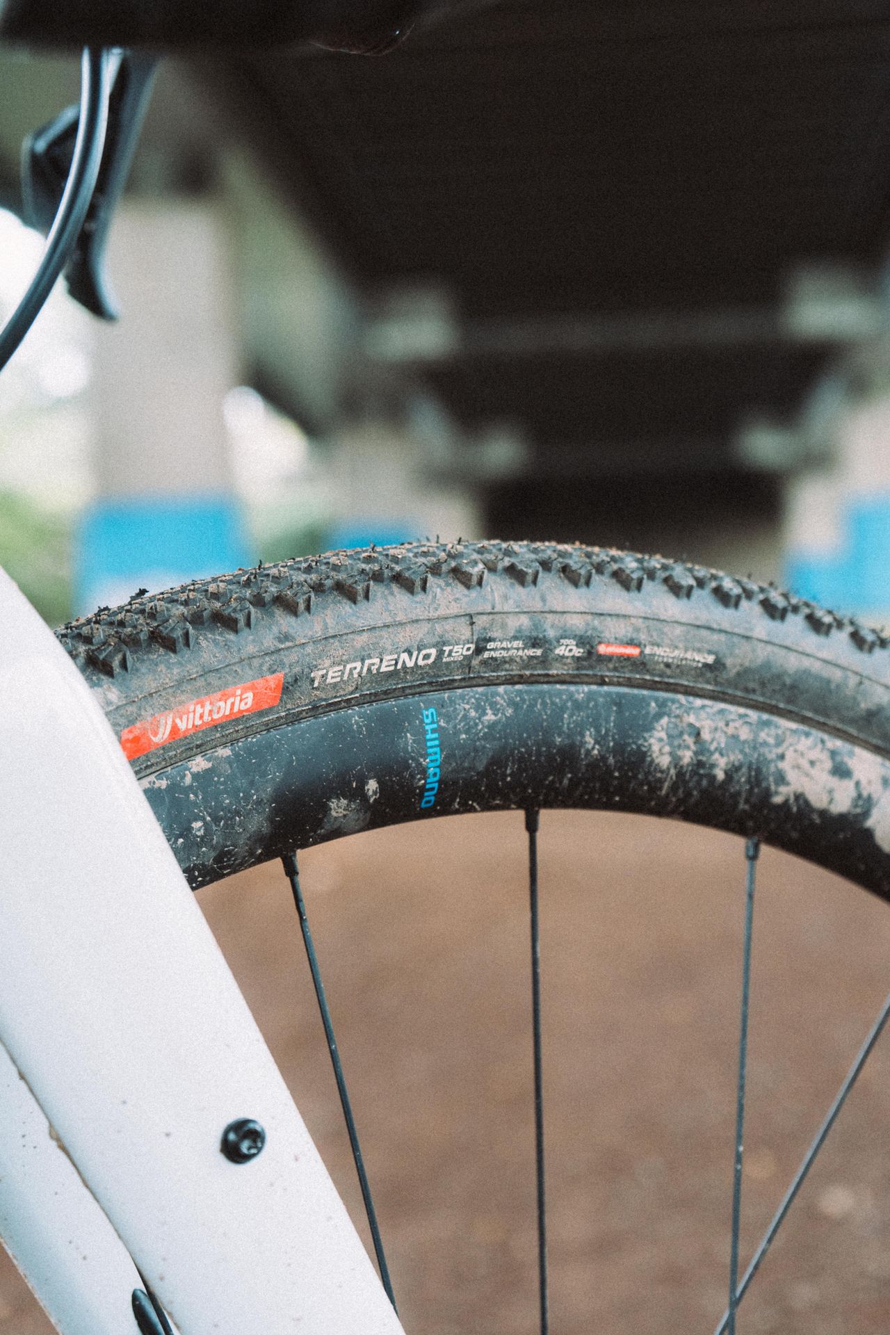 A muddy carbon front wheel