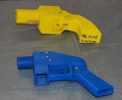 Two 3D-printed guns.