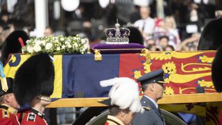 The coffin of Queen Elizabeth II, adorned with a Royal Standard and the Imperial State Crown is pulled by a Gun Carriage of The King's Troop Royal Horse Artillery, during a procession from Buckingham Palace to the Palace of Westminster, in London, United Kingdom on September 14, 2022.