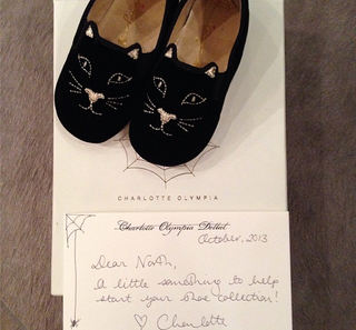North West Shoes on top of hand written letter