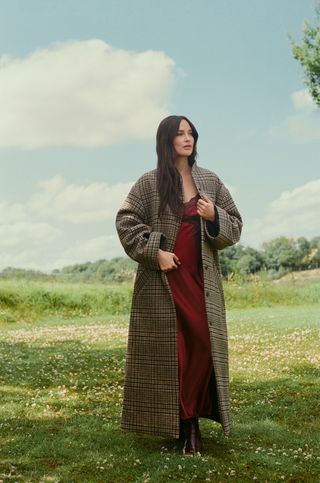 Kacey Musgraves poses on a Cotswolds estate wearing the horse girl trend from her Reformation collection