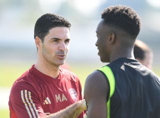 DUBAI, UNITED ARAB EMIRATES - JANUARY 10: Arsenal manager Mikel Arteta with Eddie Nketiah during a training session at NAS Sports Complex on January 10, 2024 in Dubai, United Arab Emirates. (Photo by Stuart MacFarlane/Arsenal FC via Getty Images)