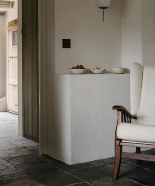 Neutral warm beige entryway with dark slate floor