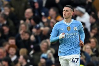 Phil Foden in action for Manchester City against Manchester United in March 2024.
