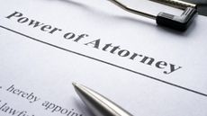 Paperwork that says power of attorney across the top.
