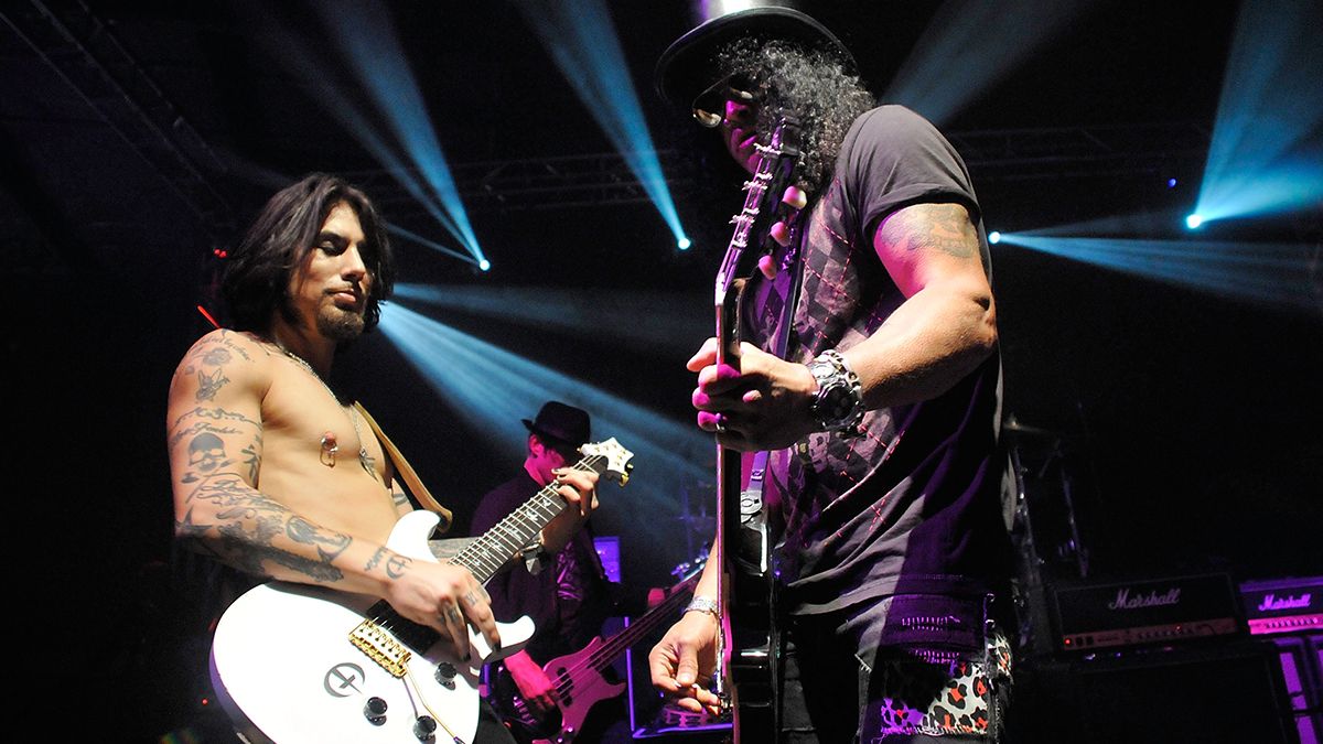 Velvet Revolver guitarist Slash performs with guitarist Dave Navarro of all-star cover band Camp Freddy at the benefit grand opening of celebrity vehicle customization shop Galpin Auto Sports (GAS) on October 18, 2008 in Van Nuys, California.