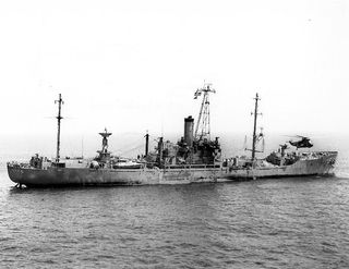 USS Liberty (AGTR-5) receives assistance from units of the Sixth Fleet, after she was attacked and seriously damaged by Israeli forces off the Sinai Peninsula on 8 June 1967. An SH-3 helicopter is near her bow.