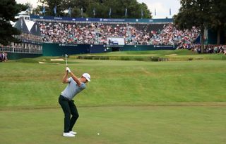 Justin Rose hits his second shot into the 18th at Wentworth