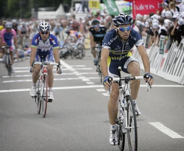 Riders cross the line ahead of a massive crash.