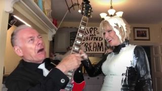 A cream-covered Toyah with Robert Fripp in their kitchen
