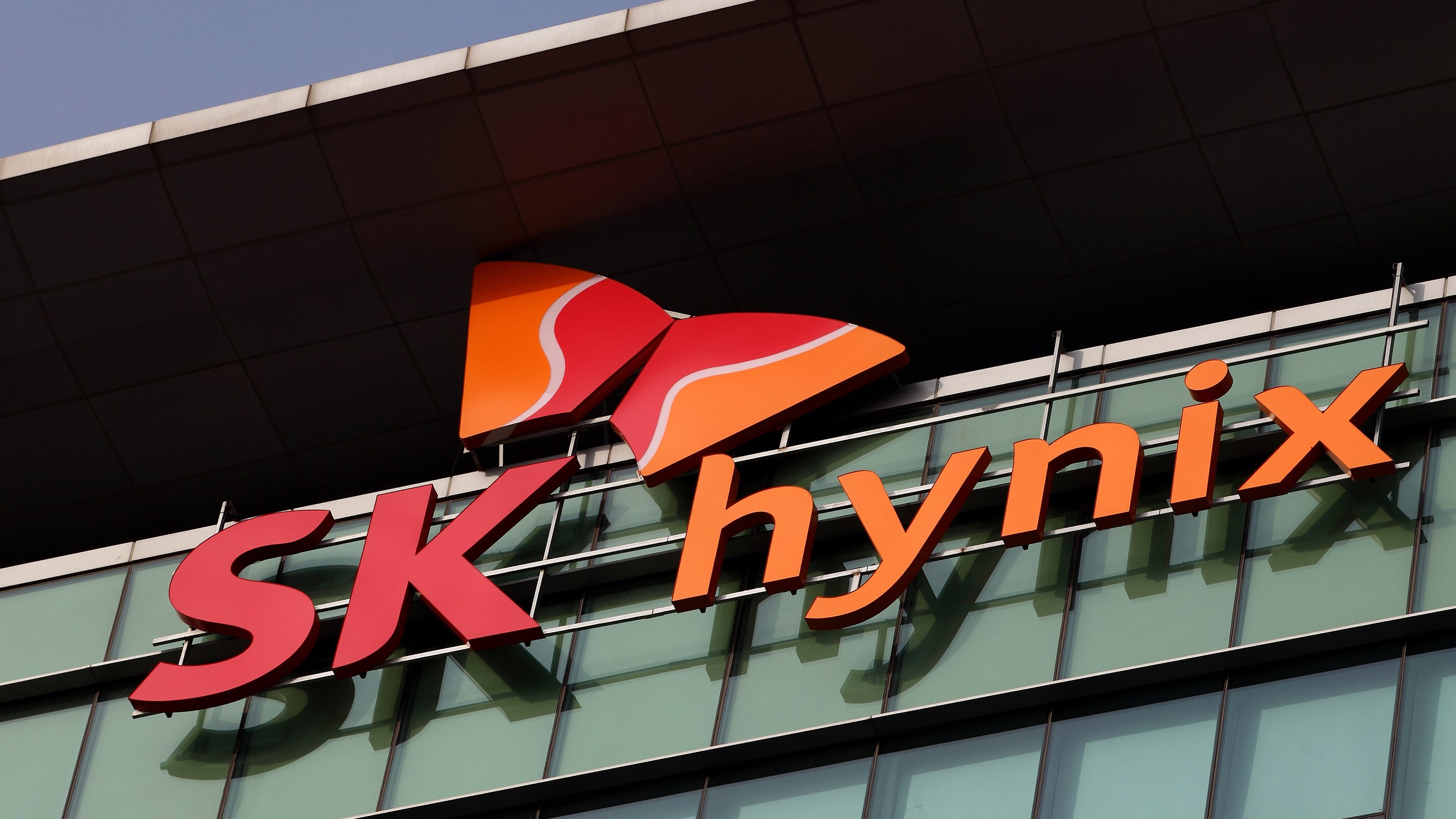 The SK Hynix Semiconductor Inc. logo is displayed at the company's plant during a media tour organized by Korea Industrial Complex Corp. (KICOX) in Cheongju, South Korea, on Friday, Nov. 23, 2012.