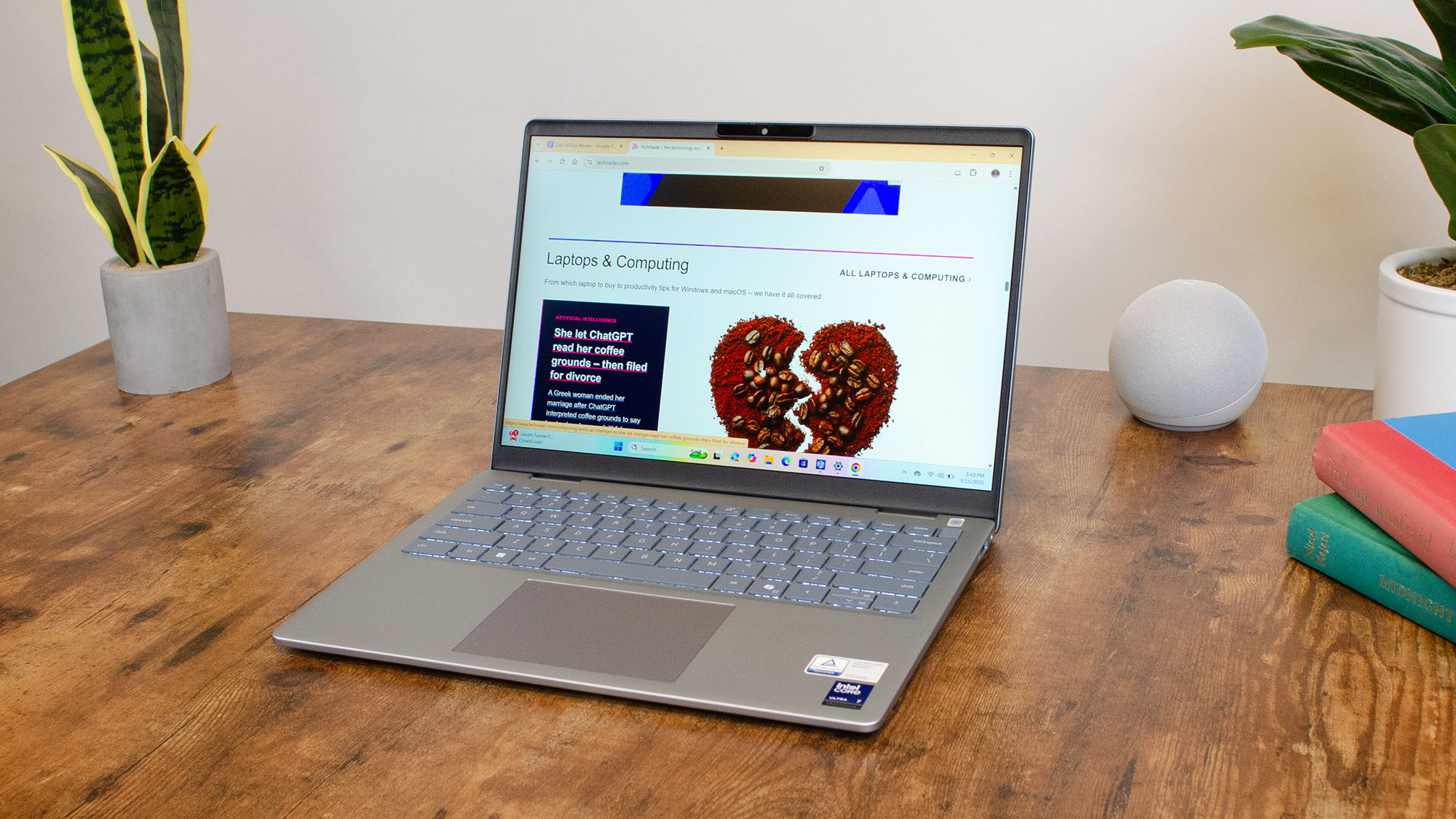A Dell 14 Plus open to the TechRadar homepage