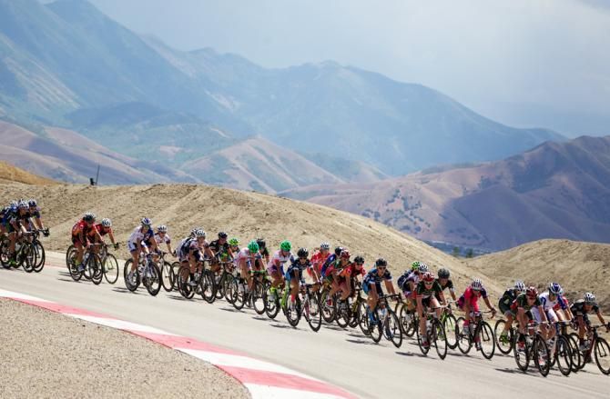 Tour of Utah Women's Edition racing in the Tooele valley near the Oquirrh Mountains.