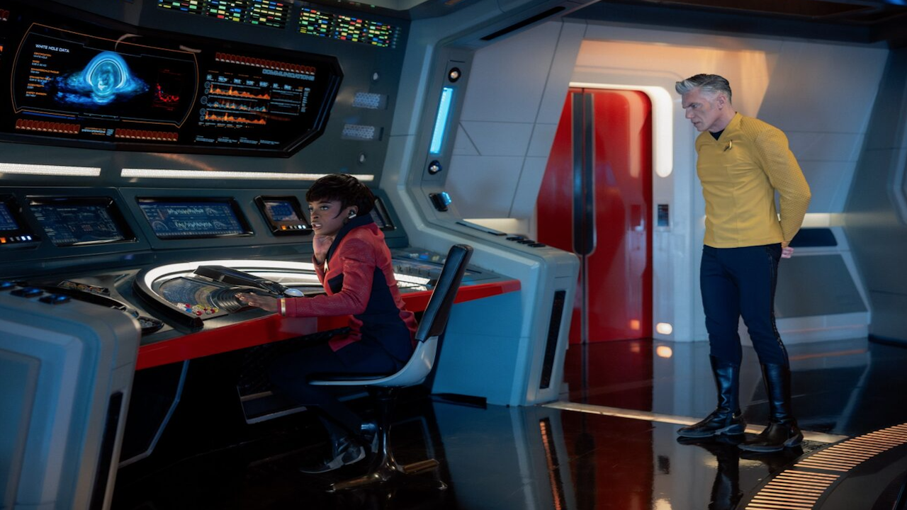 a man and woman on a sci-fi tv show aboard a spaceship