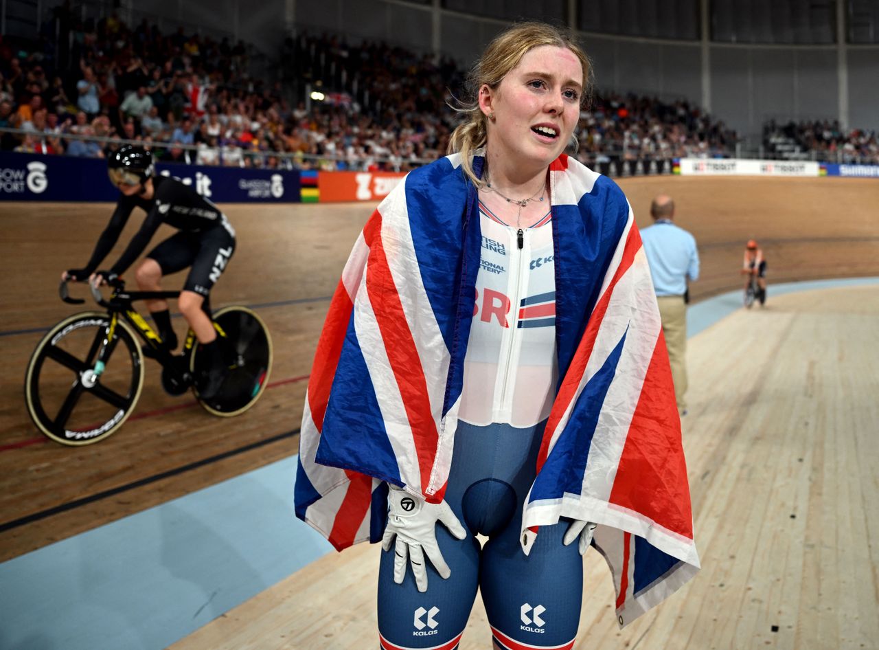 Emma Finucane with a union jack draped on her shoulders