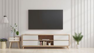 Best TV 2022: image shows TV mounted on a lounge wall