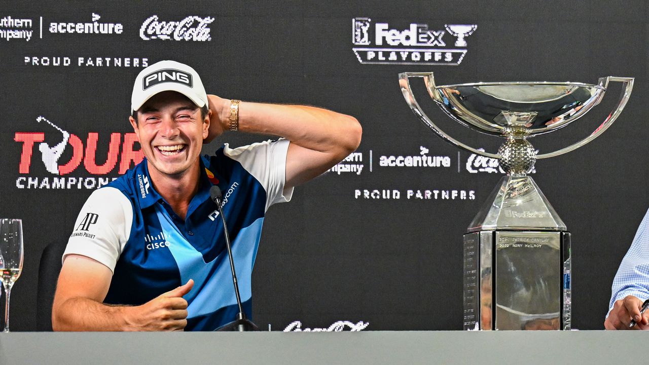 Viktor Hovland smiles with the FedEx Cup at his Tour Championship press conference