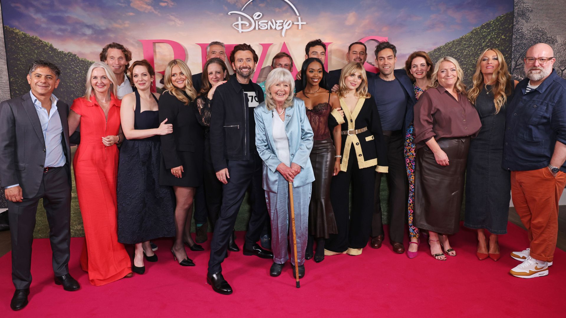 The cast of Disney+'s Rivals, with Jilly Cooper at the UK screening in 2024