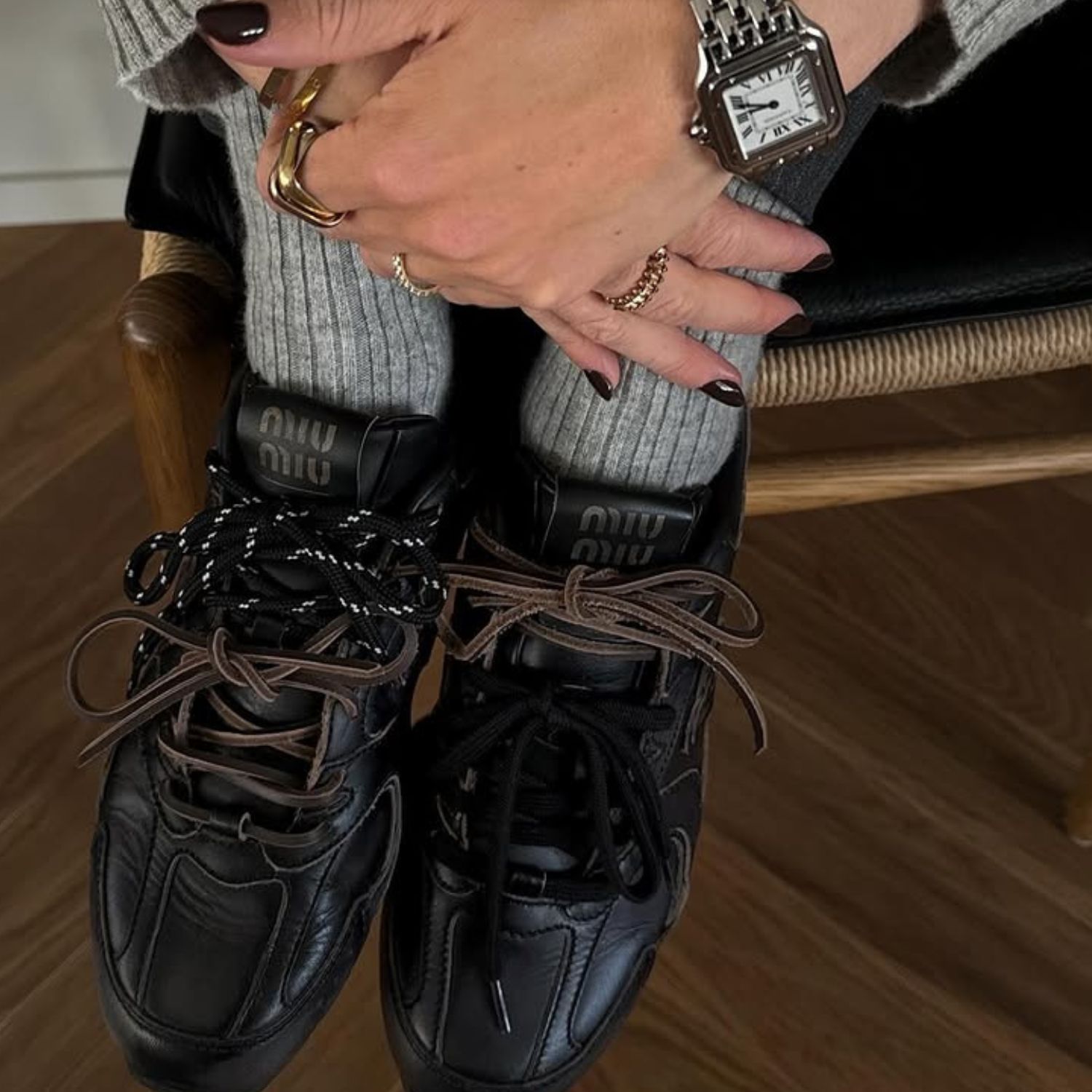 An image of @annabelrosendahl wearing one of the best black trainers, the Miu Miu x New Balance 530s. 