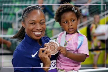 Allyson Felix holding daughter Camryn