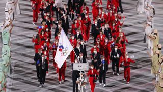 tokyo, japan july 23 flag bearers sofya velikaya and maxim mikhaylov of team roc lead their team in during the opening ceremony of the tokyo 2020 olympic games at olympic stadium on july 23, 2021 in tokyo, japan photo by clive brunskillgetty images