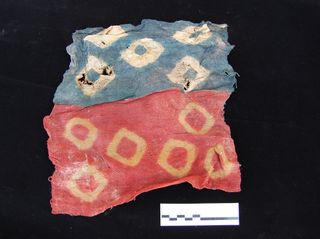 Some beautiful textiles were buried with the people in the funerary pits. The dry climate helped to preserve many of them.