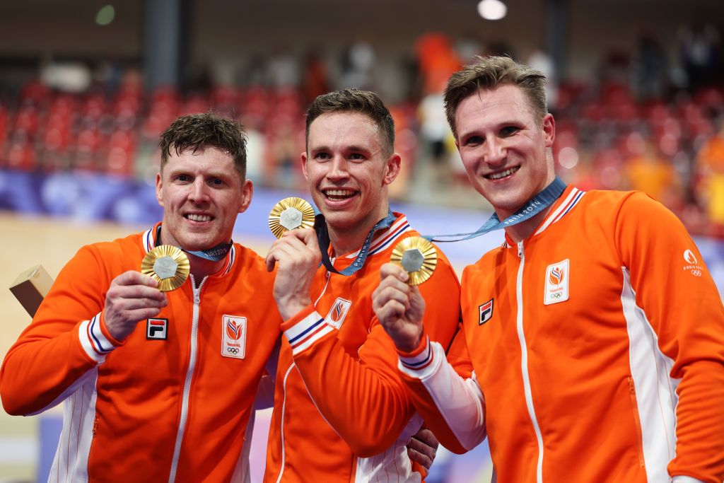 PARIS FRANCE AUGUST 06 Gold medalists Jeffrey Hoogland Harrie Lavreysen and Roy van den Berg of Team Netherlands pose on the podium after the Mens Team Sprint Finals on day eleven of the Olympic Games Paris 2024 at SaintQuentinenYvelines Velodrome on August 06 2024 in Paris France Photo by Tim de WaeleGetty Images