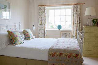 Added bedroom with floral fabrics as extension alternative