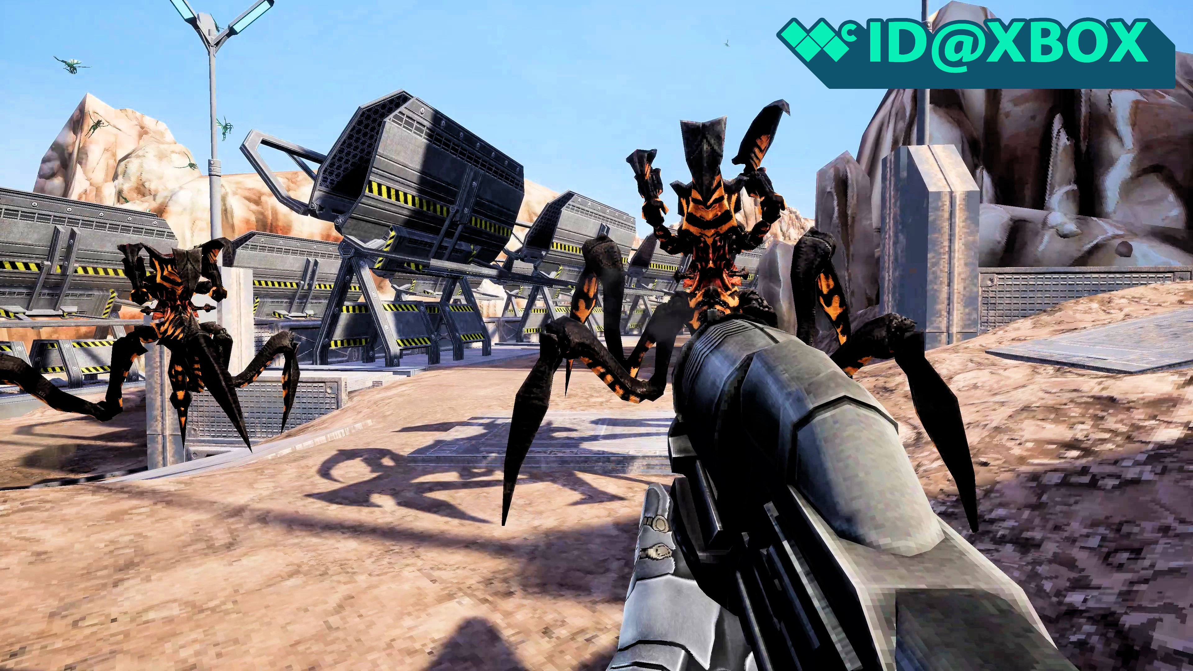 Starship Troopers Ultimate Bug War screenshot from a first-person perspective featuring a firearm aimed at large arachnid invaders.