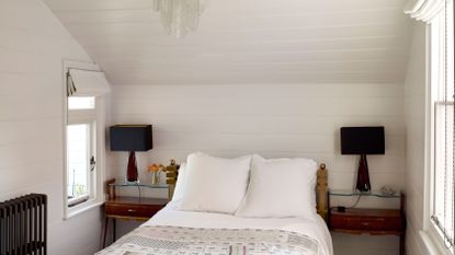 Rustic bedroom with white panelling