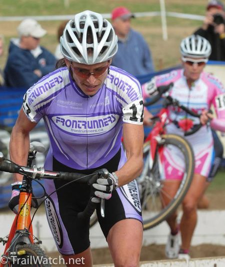 Wendy Simms (Frontrunners) racing ahead of Miller on the barriers