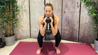 Kate Rowe-Ham doing sumo squat with weight