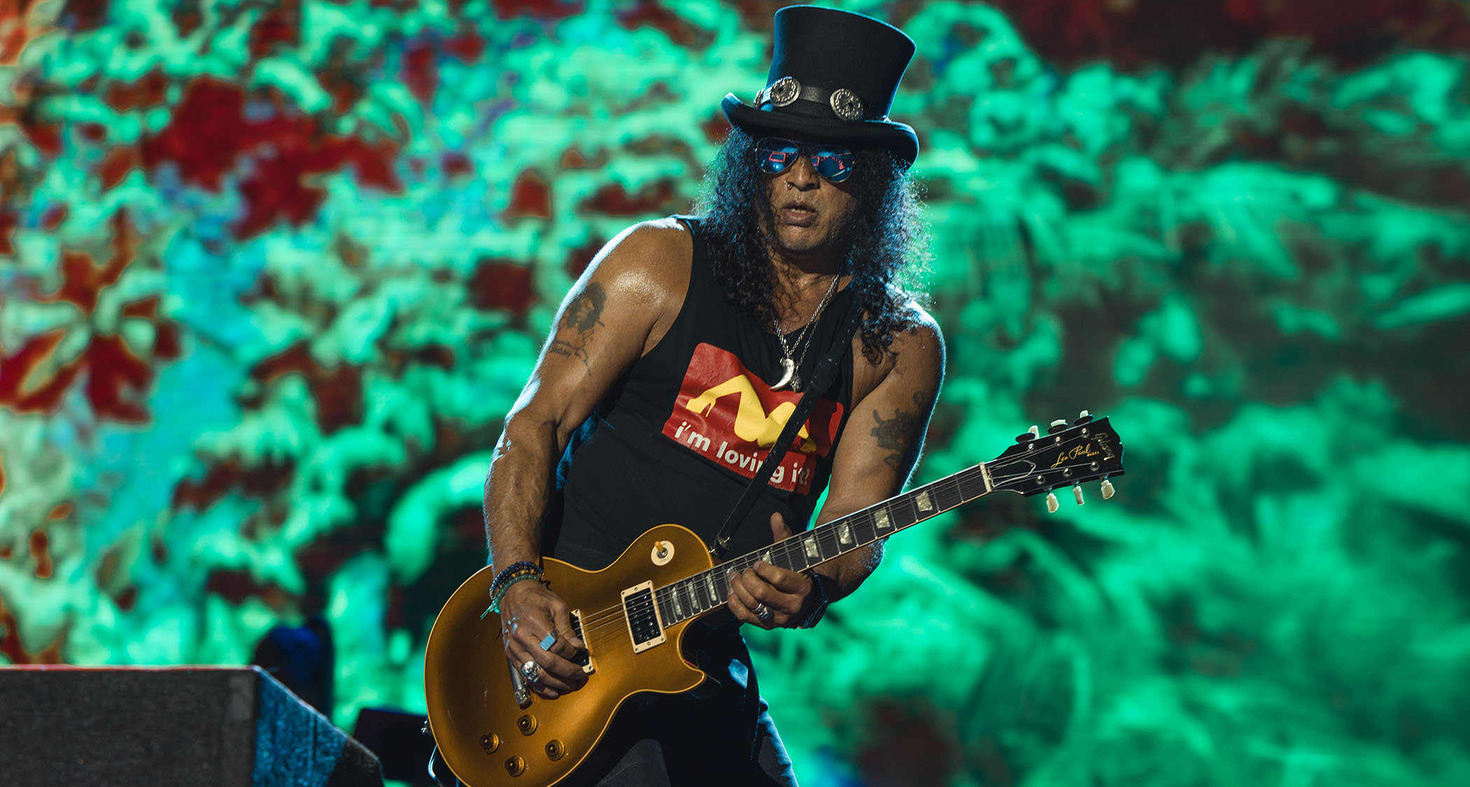 Slash wears his trademark top hat and plays his trademark Les Paul live onstage with Guns N&#039; Roses circa 2025