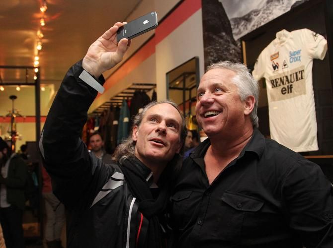 Greg LeMond poses with a fan at the opening night of his exhibition at the Rapha Cycle Club in New York