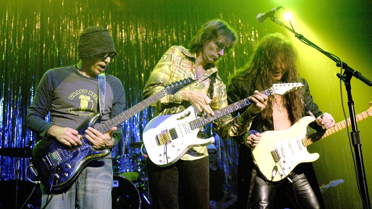 From left, Joe Satriani, Steve Vai, and Yngvie Malmsteen perform, Chicago, Illinois, October 24, 2003