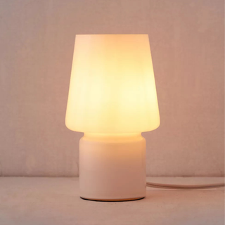 A white glass table lamp
