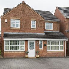 house exterior with white windows and door