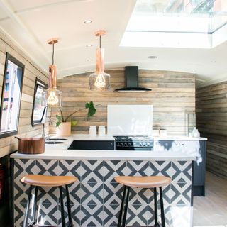 kitchen with rehm pendant light and diamond print tiles