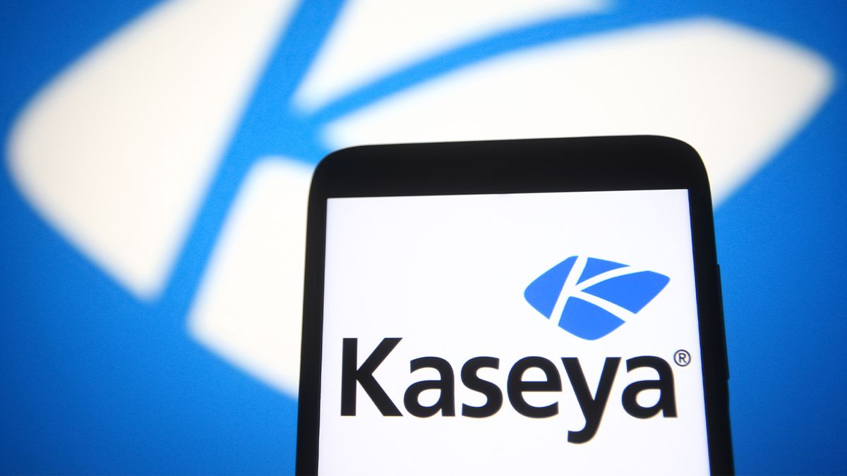 Kaseya logo displayed on a smartphone with branding in background.