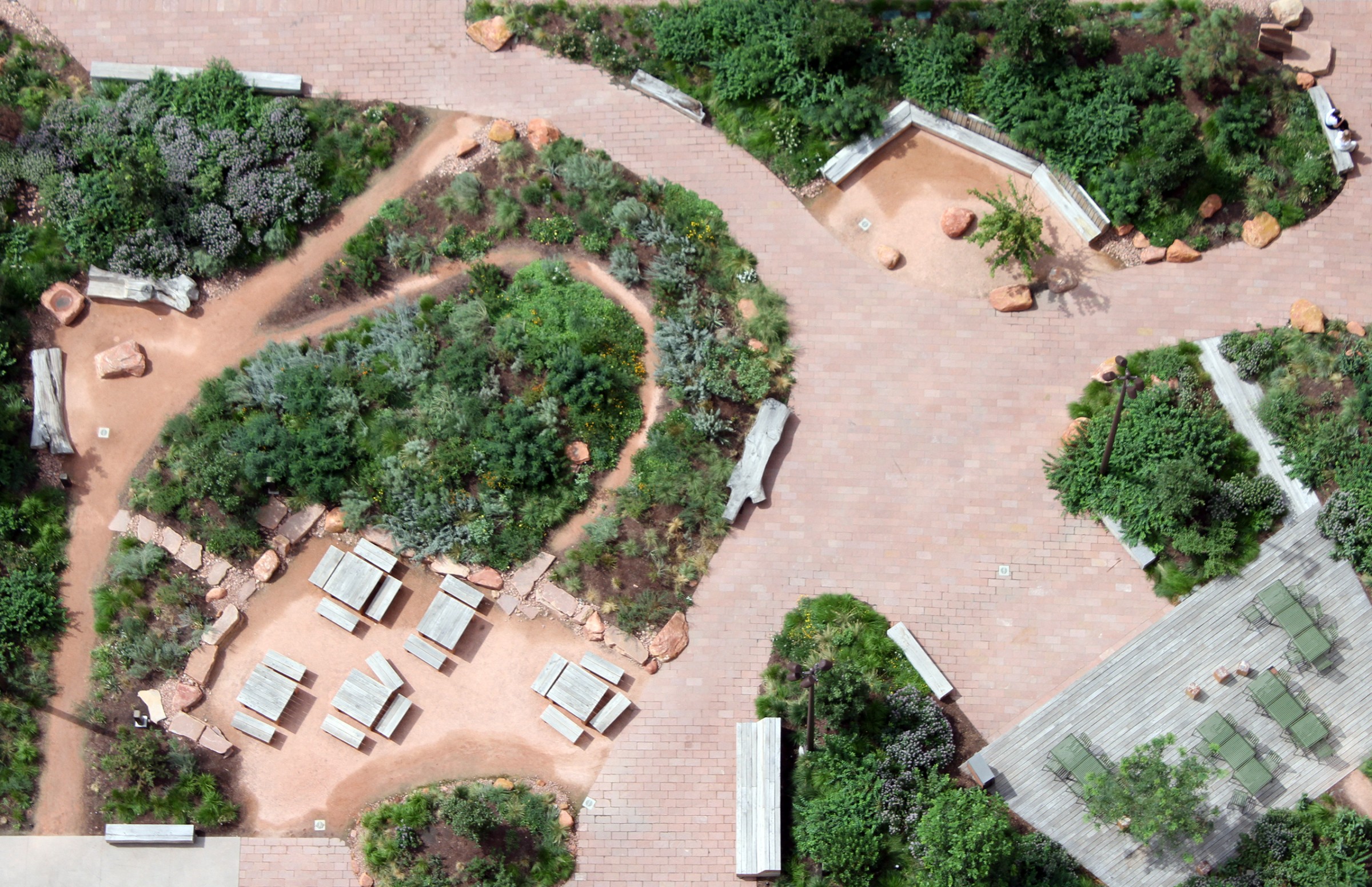 green landscape by studio Terremoto in california, peppered with light timber structures